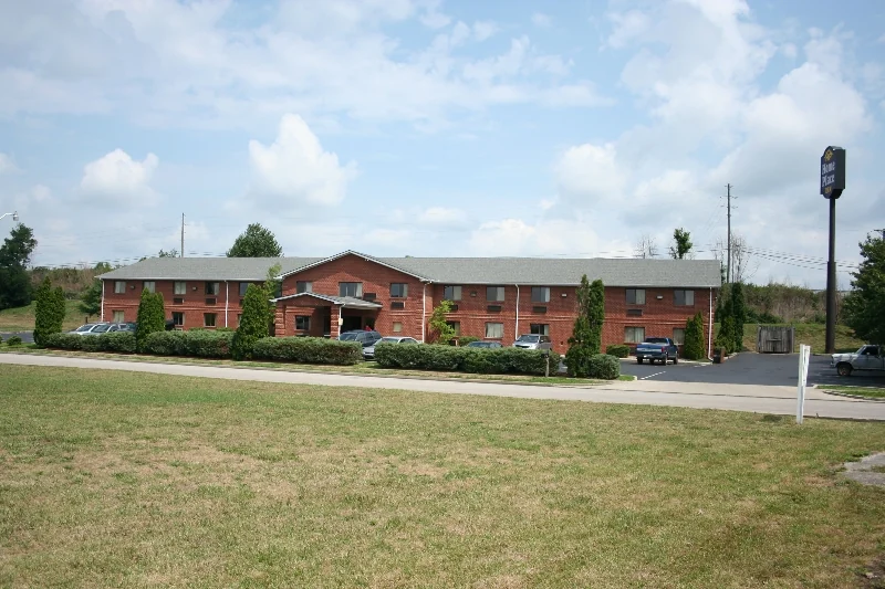 Exterior of Home Place Inn Extended Stay Motel in Nicholasville, Kentucky, with landscaped lawn